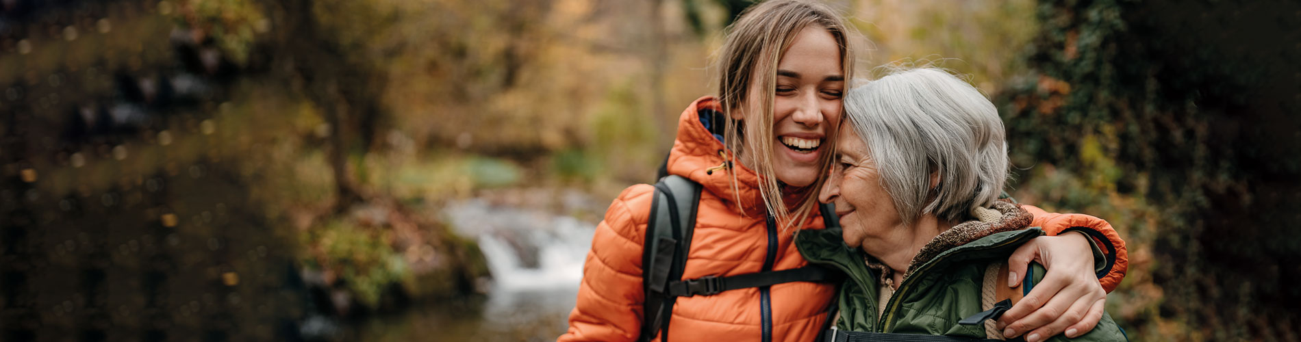 Older mother hiking with daughter, embrace, trust, support, blood cancer, oncology, Clinical Genomics 
